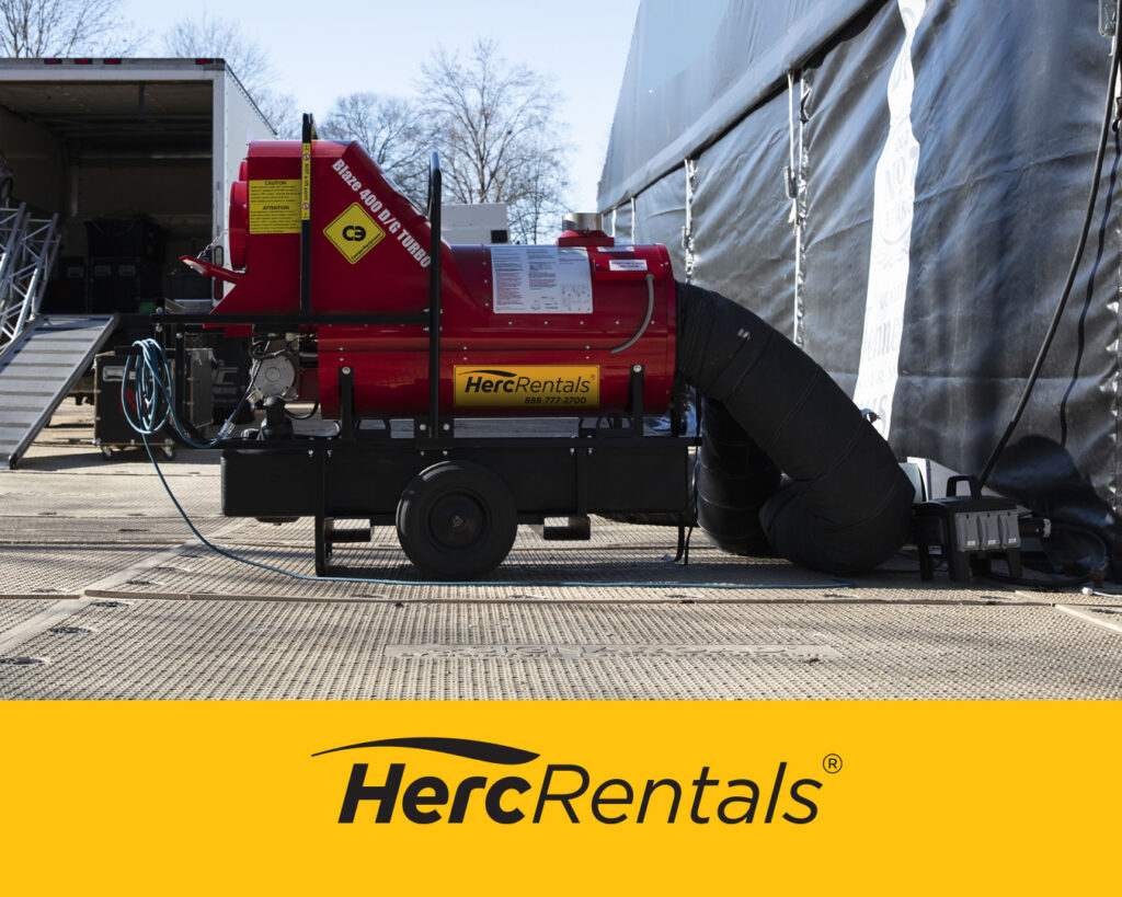 A Herc Rentals indirect fired heater safely ducts heat into a jobsite during cold weather. 