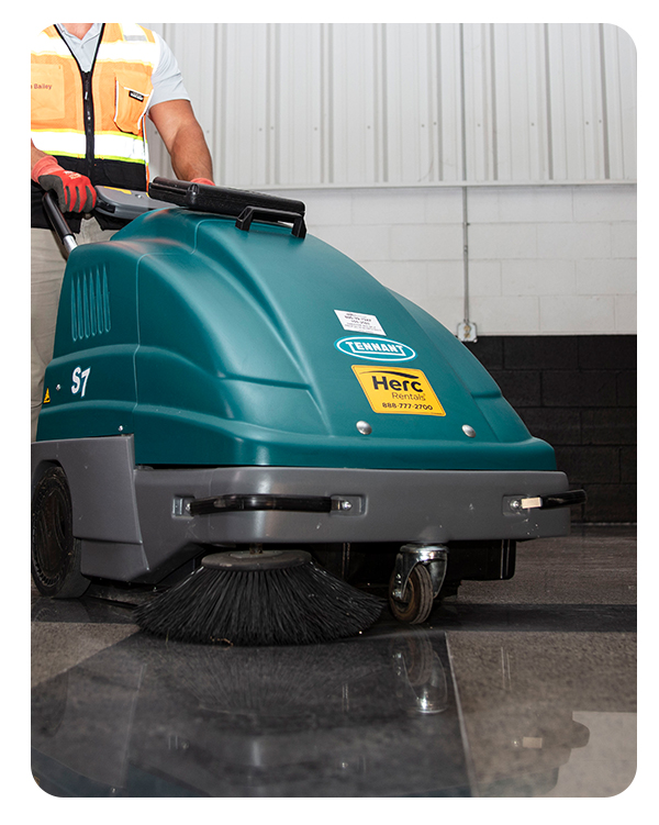 Floor maintenance starts with the right equipment, like the floor sweeper pictured in an industrial space.