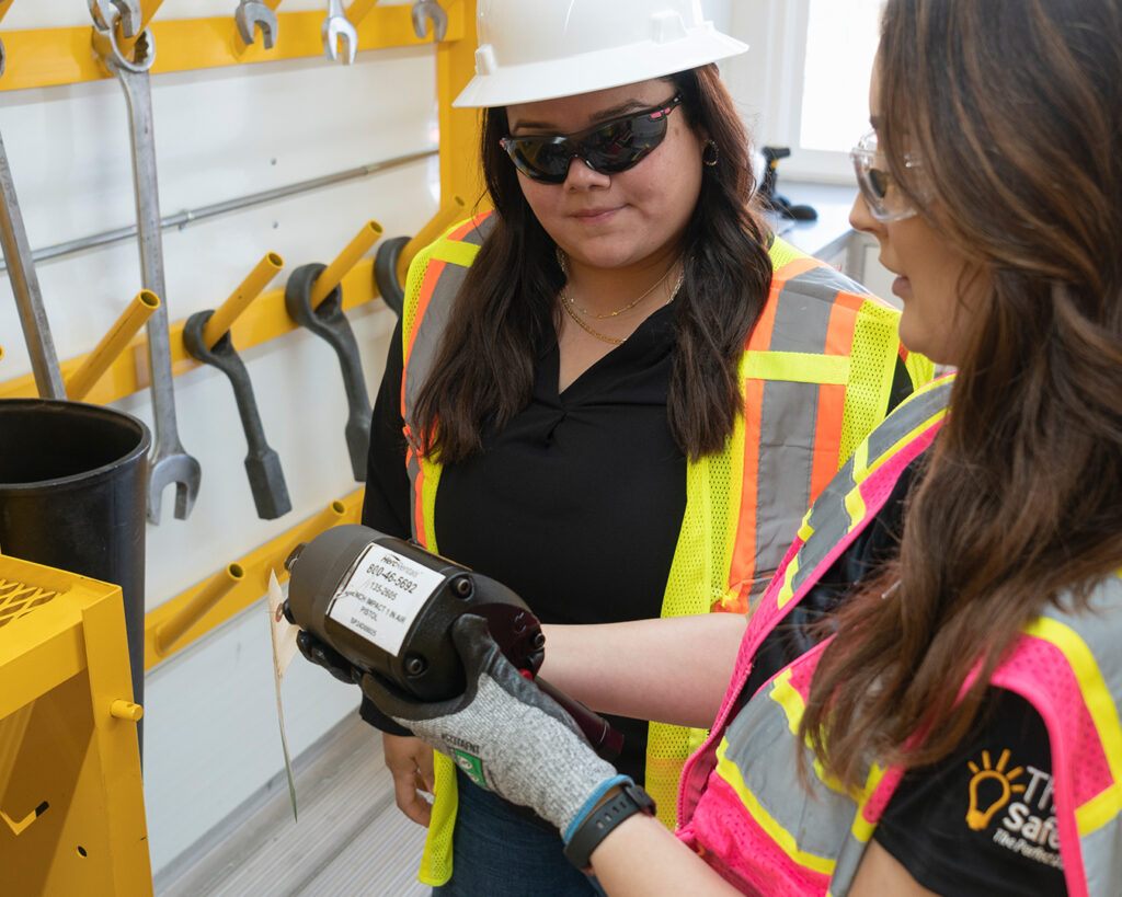 A customer and employee talk about the benefits of renting a skid steer.