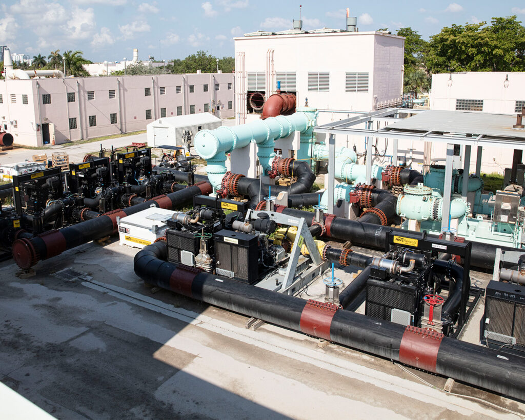 A series of Herc Rentals pumps are pictured onsite.