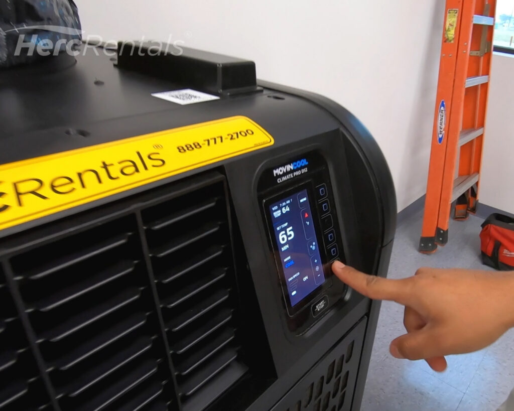 Wondering how climate control helps improve warehouse energy efficiency? The first step to improving energy efficiency is temperature measurement, as shown in an image of portable AC unit with a programmable thermostat.