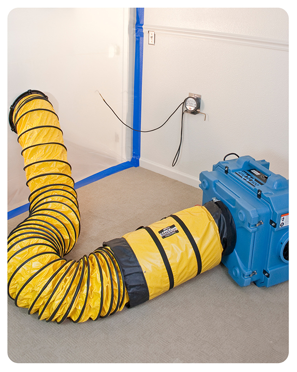 Air scrubbers, like the one pictured in a building, are effective pieces of equipment when it comes to construction dust control.